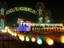 Visitors to Meadow Lights take the train through the multiple acres of lights displayed during the holiday season. 