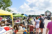 Crowds at last year's 301 Endless Yard Sale shop along a row of vendor booths. 