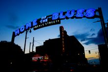 Illuminated Beale Street sign at dusk.