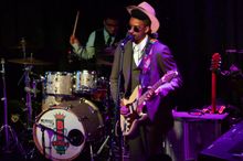 Musician playing an electric guitar on stage at B.B. King's Blues Club on Beale. 