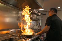 Junda Khoo cooking the Flying Noodles dish at Scenic World 