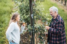 Two people enjoying local drinks in Hardanger