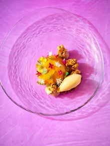 The 'Imagine' dessert inspired by the Vivid light installations projected onto the Opera House. Made with milk chocolate, passionfruit and banana topped with popcorn.