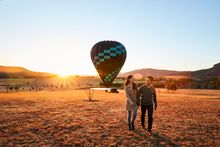 Couple arriving for a sunrise hot air balloon ride with Beyond Ballooning in the Hunter Valley