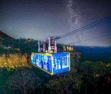 Illuminated Skyway with the lit up Three Sisters 