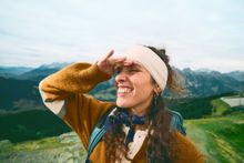 A woman wearing a knitted headband.