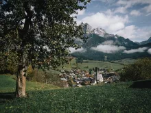 The Eder Collection Maria Alm: A panoramic view of the Eder hotels in a mountain setting.