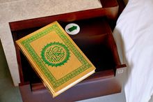 Each room is equipped with a Quran and Qibla directional sign