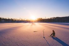 Ice fishing in Dalarna, Sweden. Photo: Roger Borgelid/Visit Sweden