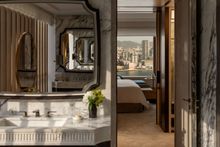The Hong Kong Suite viewed from the bathroom and through the bedroom to the views of Victoria Harbour beyond