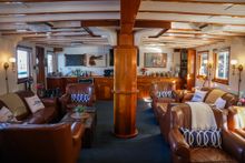 The cozy interiors of M/V Mist Cove and M/V Liseron encourage guests to relax and share stories about their experiences.
