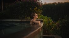 Guest at Raffles Bali Villa Pool during Sunset