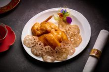 Cantonese-style crispy chicken accompanied by spicy lotus root chips (HKD 398)