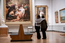 Museum of Fine Arts, Boston — Guests pause to view Benjamin West’s 1776 painting, Devout Men Taking the Body of Saint Stephen. Courtesy of Museum of Fine Arts, Boston