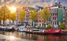 Panorama of famous dancing houses on river Amstel, Amsterdam