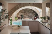 Uncover a contemporary kitchen designed around a central island