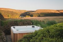 A hot tub beckons for evenings immersed in a swirl of silky bubbles