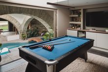 Uncover the games room, perfectly hidden behind sliding doors