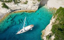 Luxury sailing yacht at anchor in a bay of the Amalfi Coast