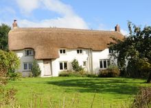 A week at St Clare, a chocolate box thatched Devon longhouse situated between the North Devon coast and Dartmoor, can be booked 