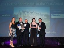 Jody Marshall (2nd from left) and deputy manager Gail Schofield (2nd from right) collecting the award 