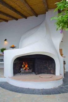The bespoke Gaudi inspired fireplace also includes bread and tandoori ovens, plus a barbecue