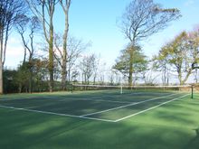 All weather tennis court at Glebe House Cottages