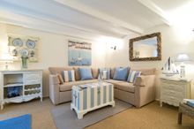 The Rigging has a large living room with a stylish corner sofa, provincial French-style painted furniture and woodland views.   