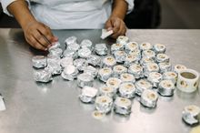 Hand labelling Pepe Saya Qantas size 15gm