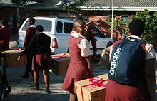 Learners help unpack their PCs form the First Car Rental Van