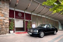A luxurious four-seater Bentley with chauffeur service at guests’ beck and call