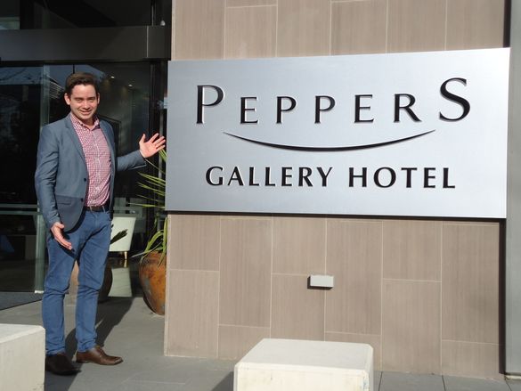 Peppers GM James Sharrock in front of the new Peppers signage