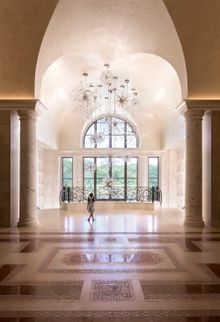  The custom firework-inspired crystal chandelier in the grand entryway evokes a sense of wonder. 