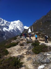 Nepal Trek - hiking past monument - Aurora Expeditions