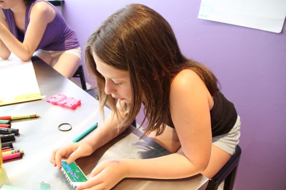 Kids Board member Caitlin reviewing the Bound Round app