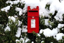 Snow covered post box