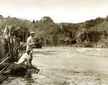 Alan Pye with his dog Major fishing the Waikato River 1931