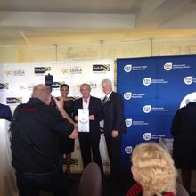 Maxleigh Derman accepting the Lilizela Award on behalf of Aquila Private Game Reserve, with Alan Winde and Thembi Kunene