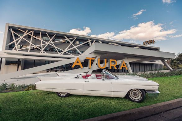 Atura Blacktown, proud new owner of a convertible 1960s Cadillac