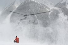 Mountain Guide Scott Belton waits for the heli