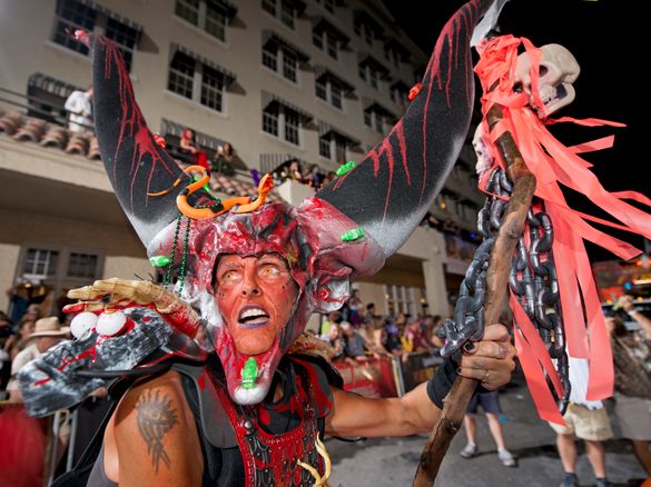 A costumed reveler participates in the 2013 Fantasy Fest Parade down Duval Street in Key West, Fla. The procession was the highl