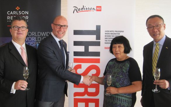 Thorsten Kirschke, president, Carlson Rezidor Hotel Group, Asia Pacific   with Mdm Lv Li Hua, of Shenyang New Times Investment C