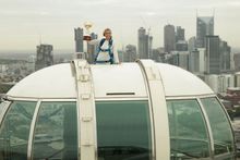 Edwina Bartholomew with the Emirates Melbourne Cup atop the Melbourne Star on Wednesday morning. Photo Credit: Getty Images