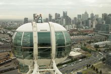 Edwina Bartholomew with the Emirates Melbourne Cup atop the Melbourne Star on Wednesday morning. Photo Credit: Getty Images