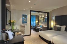 The two-bedroom Dsire Suites at dusitD2 Nairobi house spacious bedrooms with king size beds and a separate living room area. Nes