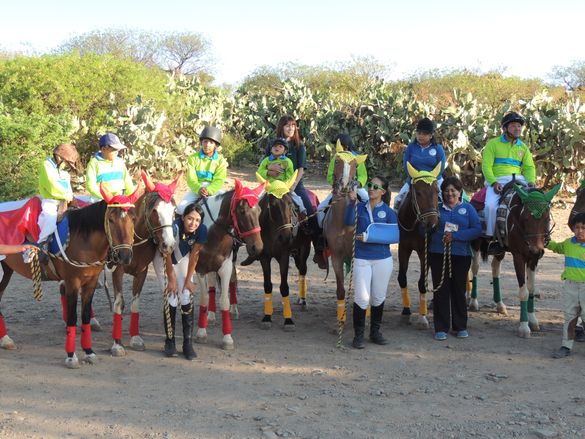 Children and staff from the Centro Ecuestre Tunari prepare for the parade