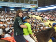 Volunteer Trish, from the UK, and little David, rode in the ceremony together
