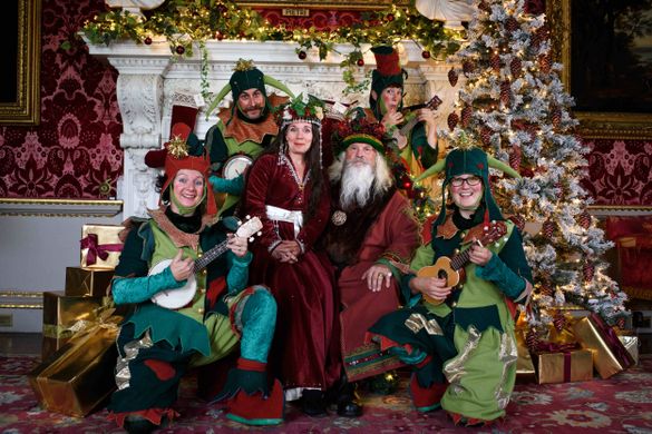 Father and Mother Christmas with the team of elves