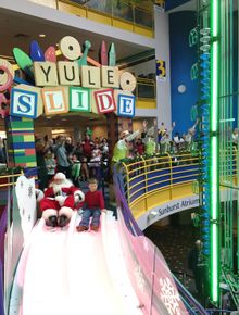 Santa sliding with a member child