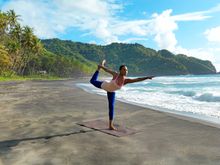 Yoga along the black sand beaches of the Atlantic Ocean at Rosalie Bay Resort, Dominica, Caribbean